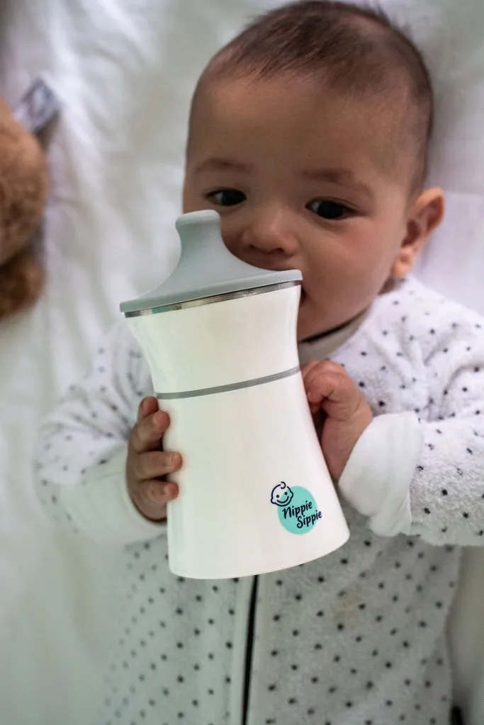 Baby with portable milk warmer bottle